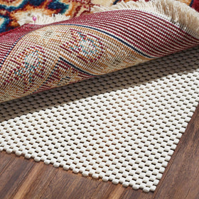 Bagail Basics non-slip rug pad on hardwood floor keeping rug in place.