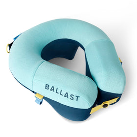 Ballast Pro Beach & Travel Pillow in airplane setup offers neck support for travelers.