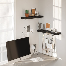 BAMEOS black shelf in bathroom provides space for towels and aromatherapy.