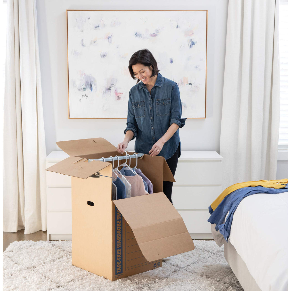 Bankers Box tall wardrobe box locking tab top secures contents during transit.