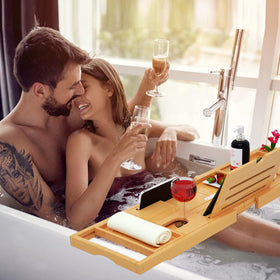 Phone holder integrated into the bath tray for hands-free viewing.