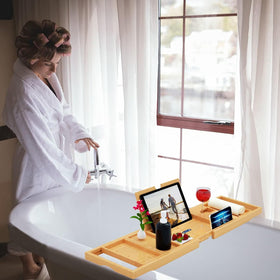 Wine glass holder on the Banlilu bath tray for a relaxing soak.