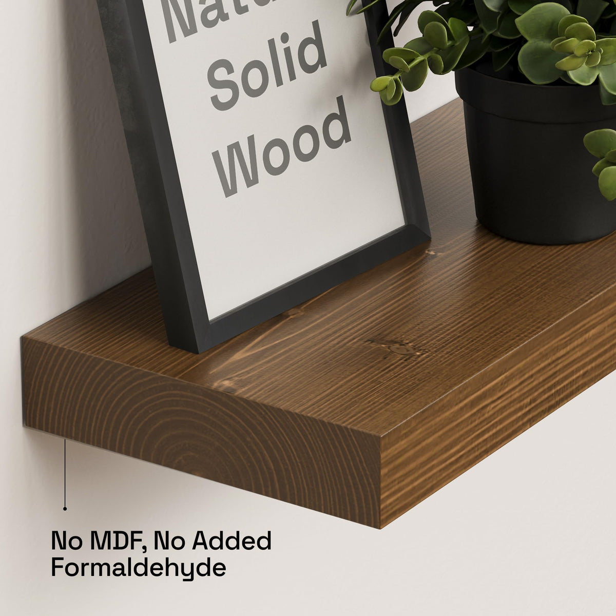 Baobab Workshop walnut floating shelf bathroom installation for toiletries organization.