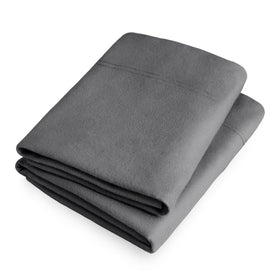 Bare Home flannel pillowcase on bed complements grey bedroom tones.