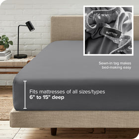 Bare Home luxury grey fabric on bed under soft lighting.