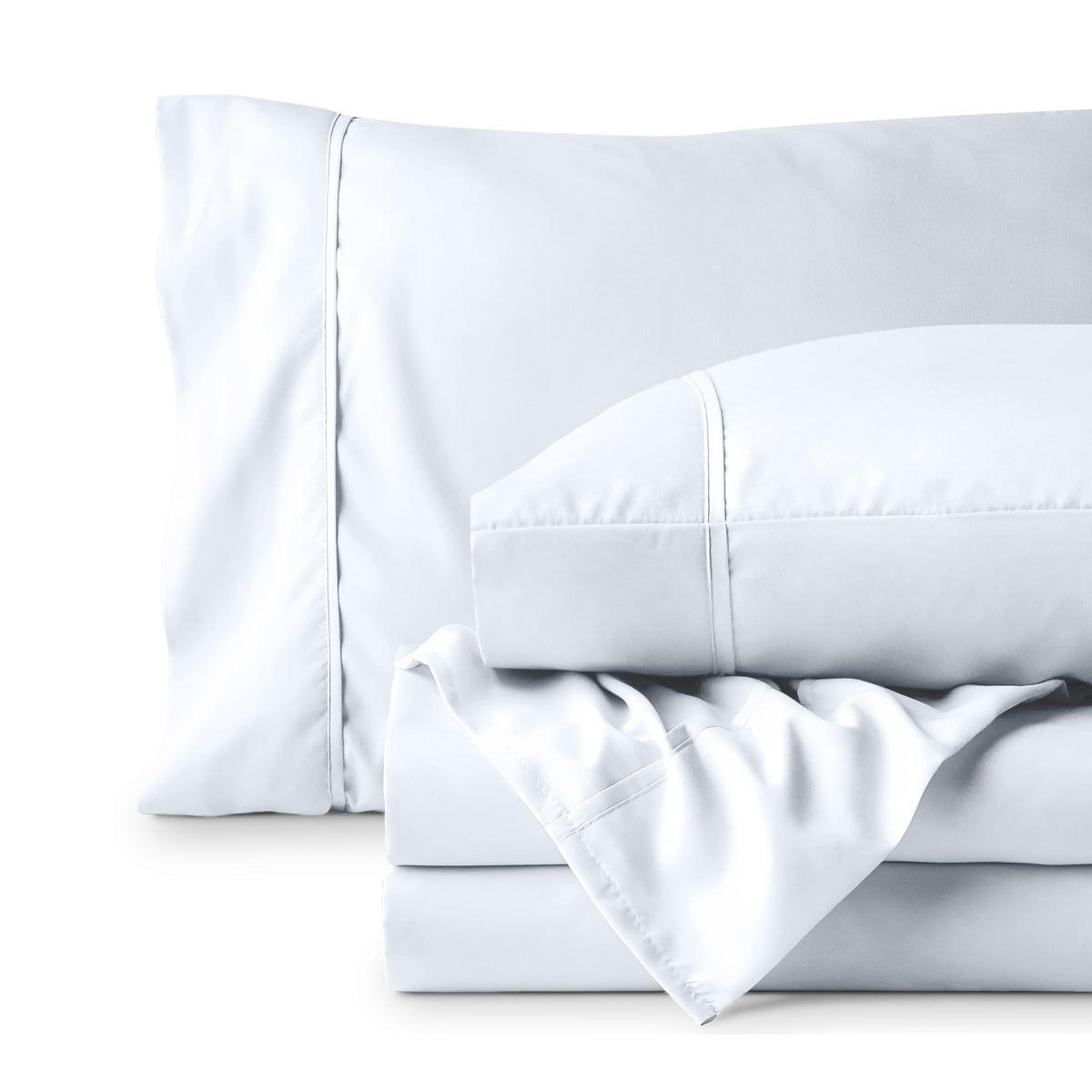 Bare Home bedroom scene with cozy white sheets for a calm retreat.