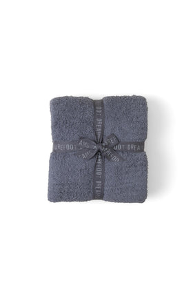 Barefoot Dreams CozyChic Throw Graphite 54x72 draped over sofa for warmth