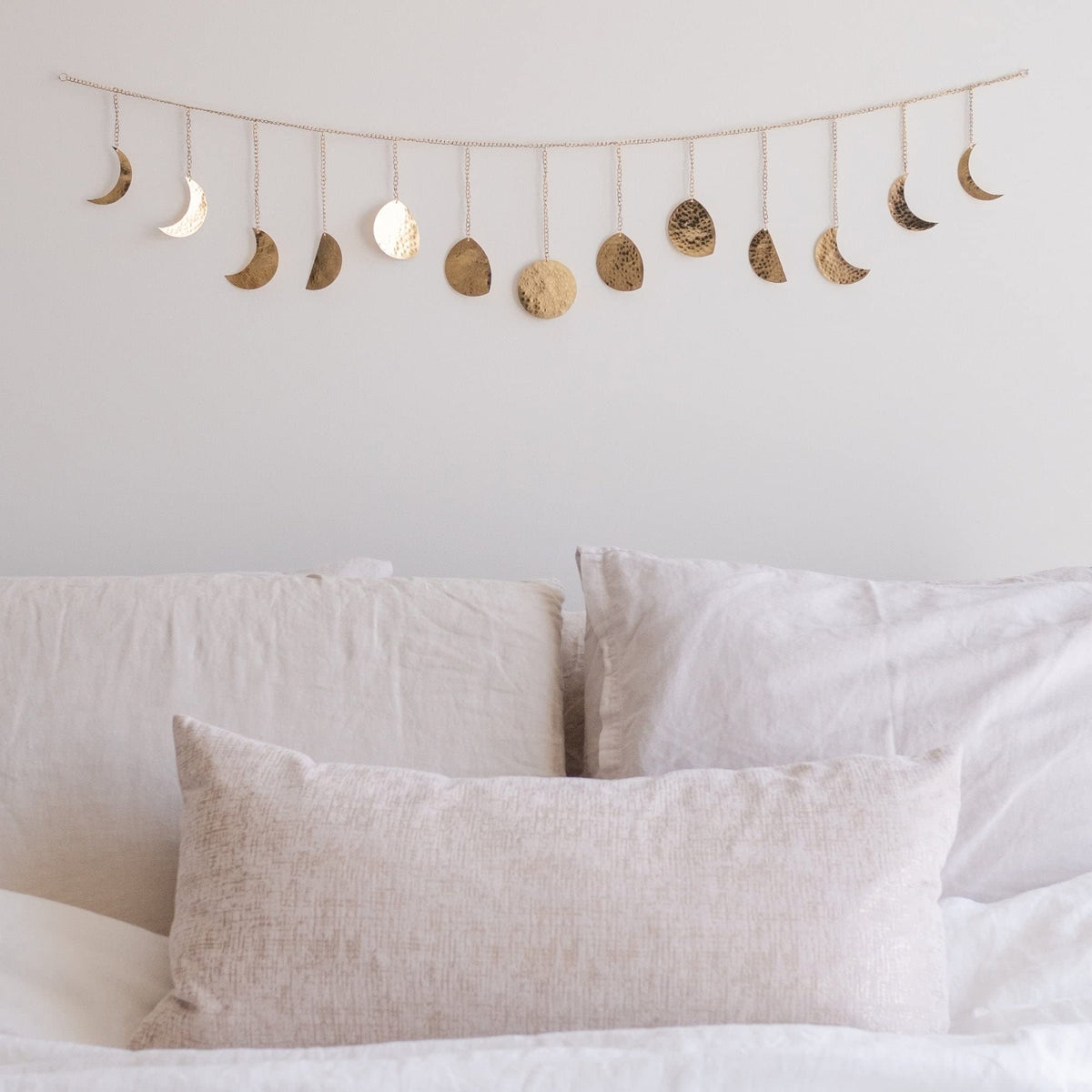 Base Roots Moon Phase Wall Decor in gold with full moon focus adds a warm glow to bedrooms.
