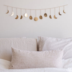 Base Roots Moon Phase Wall Decor in gold with full moon focus adds a warm glow to bedrooms.