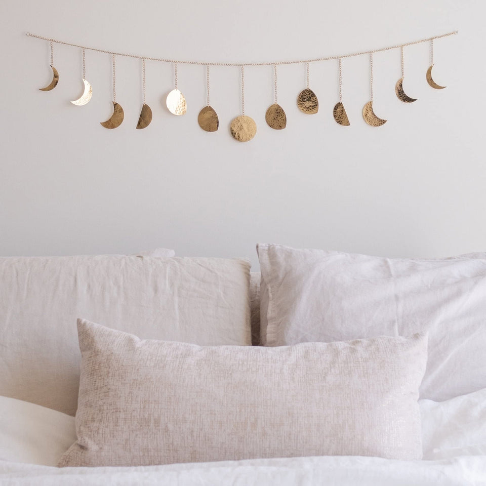 Base Roots Moon Phase Wall Decor in gold with full moon focus adds a warm glow to bedrooms.