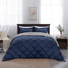 Basic Beyond coordinated navy and grey bedding in a stylish bedroom setup.