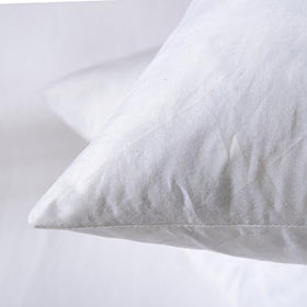 Basic Home pillow insert styled on a living room sofa for versatile decor