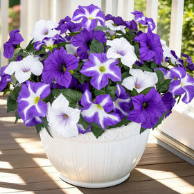 Bassion petunias faux flowers on a branch add vibrant outdoor color year-round.