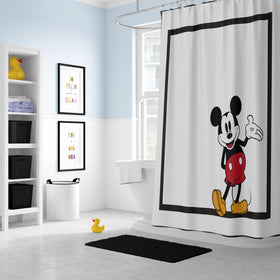 Bathroom setup featuring Mickey Mouse curtain for playful kids' decor
