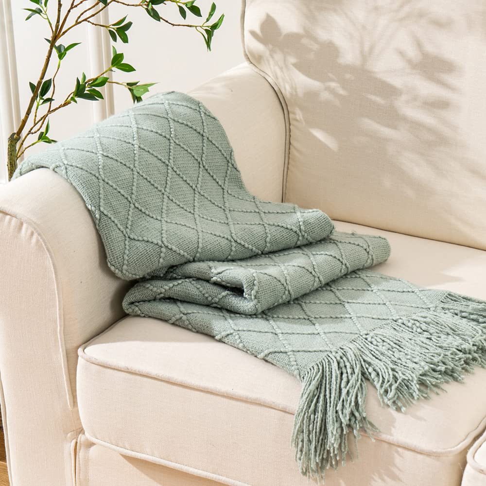 BATTILO HOME Sage Green Throw Blanket bed scarf style draped across bed for layered decor.