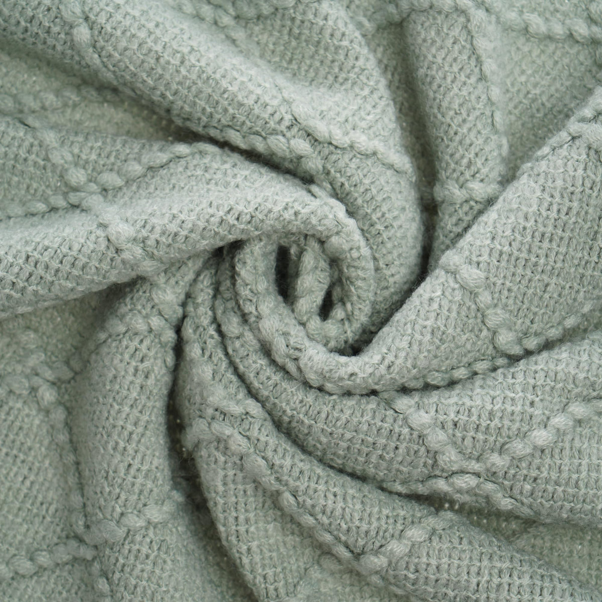 BATTILO HOME Sage Green Throw Blanket folded to showcase geometric pattern.