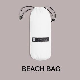 Bay Laurel Made in Türkiye towel with stylish design on sunlit sand.