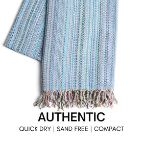 Bay Laurel sand-free beach towel dries quickly after a dip at the shore.