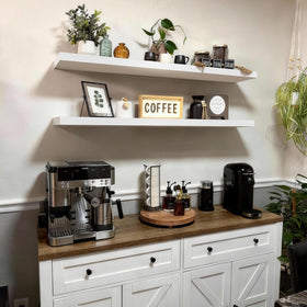 Bayka white floating shelves add bedroom storage and style.