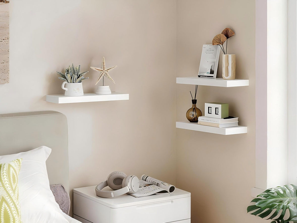 BAYKA wall shelves installed with wood and metal brackets add rustic charm to a living room display.