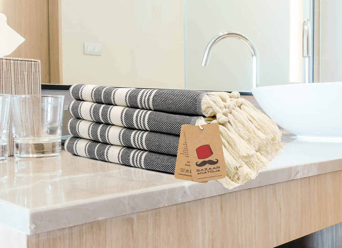 Bazaar Anatolia quick-dry towel stripe black keeps spaces tidy.