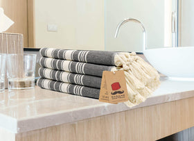 Bazaar Anatolia quick-dry towel stripe black keeps spaces tidy.