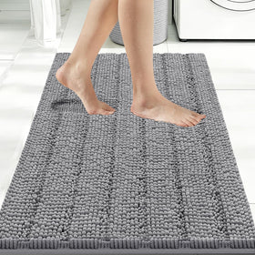 Bcoimo large bathroom rug with chenille pile for plush tub-side comfort.