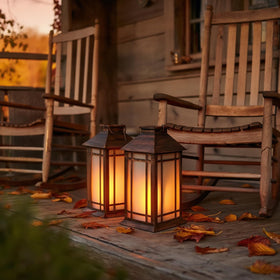 Bdor lanterns illuminating a porch at night for inviting appeal.