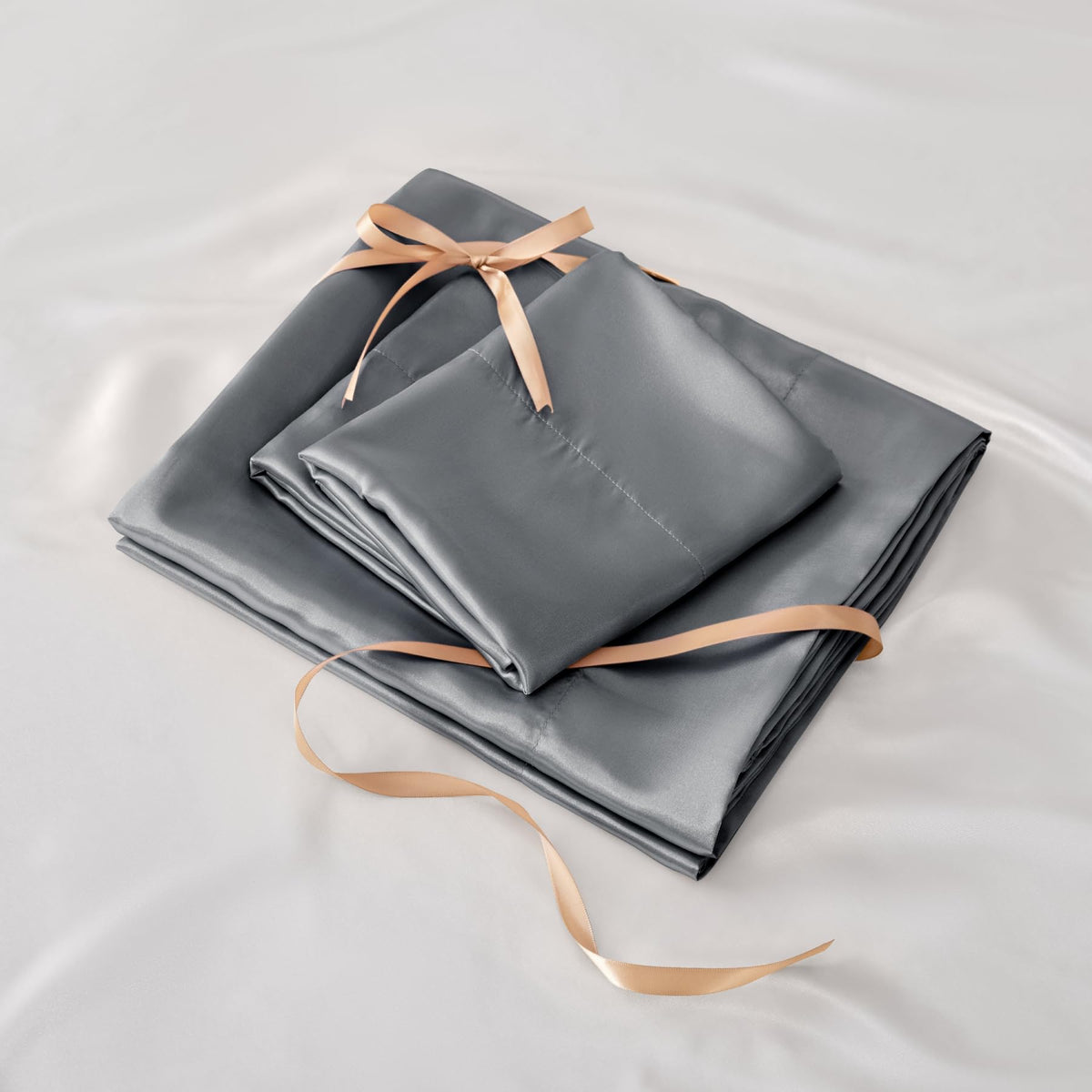 BEDELITE 4-piece satin sheet set packaging and components.