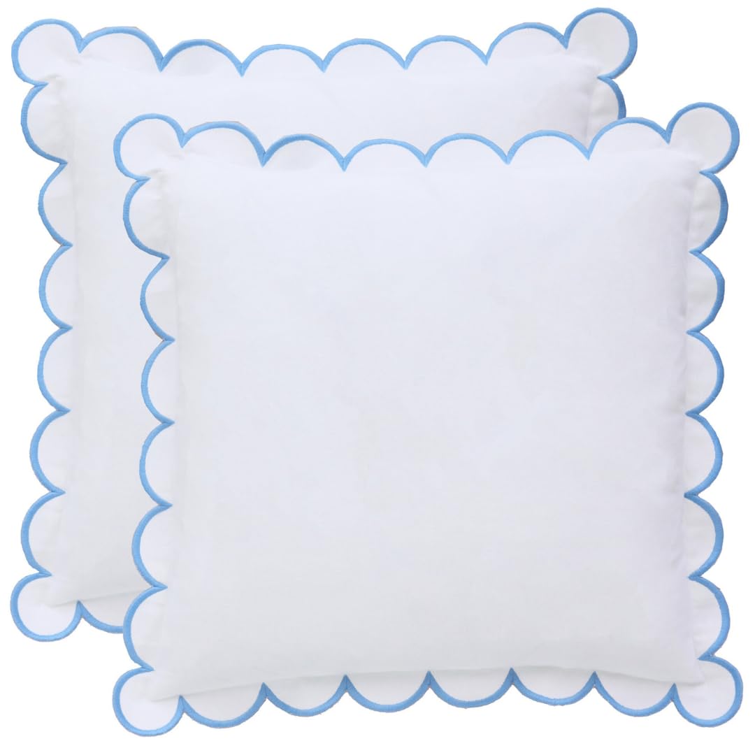 Bebe Bask Margot scalloped pillow cover in white and blue adds timeless elegance to any sofa.