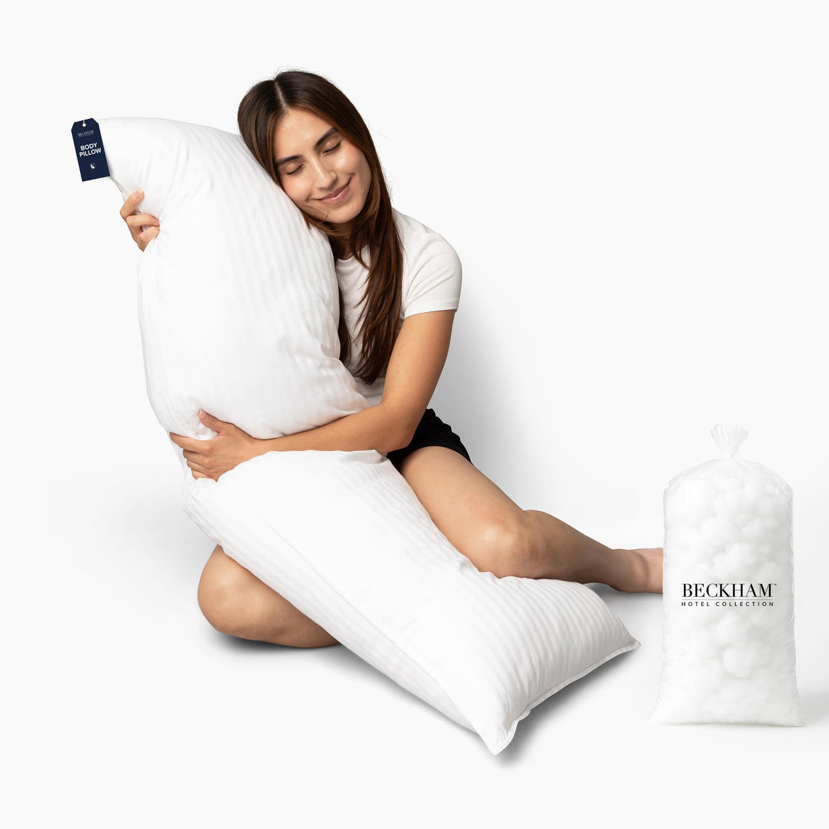 Beckham Hotel Collection body pillow 20x54 closeup shows plush cotton shell for lasting comfort.