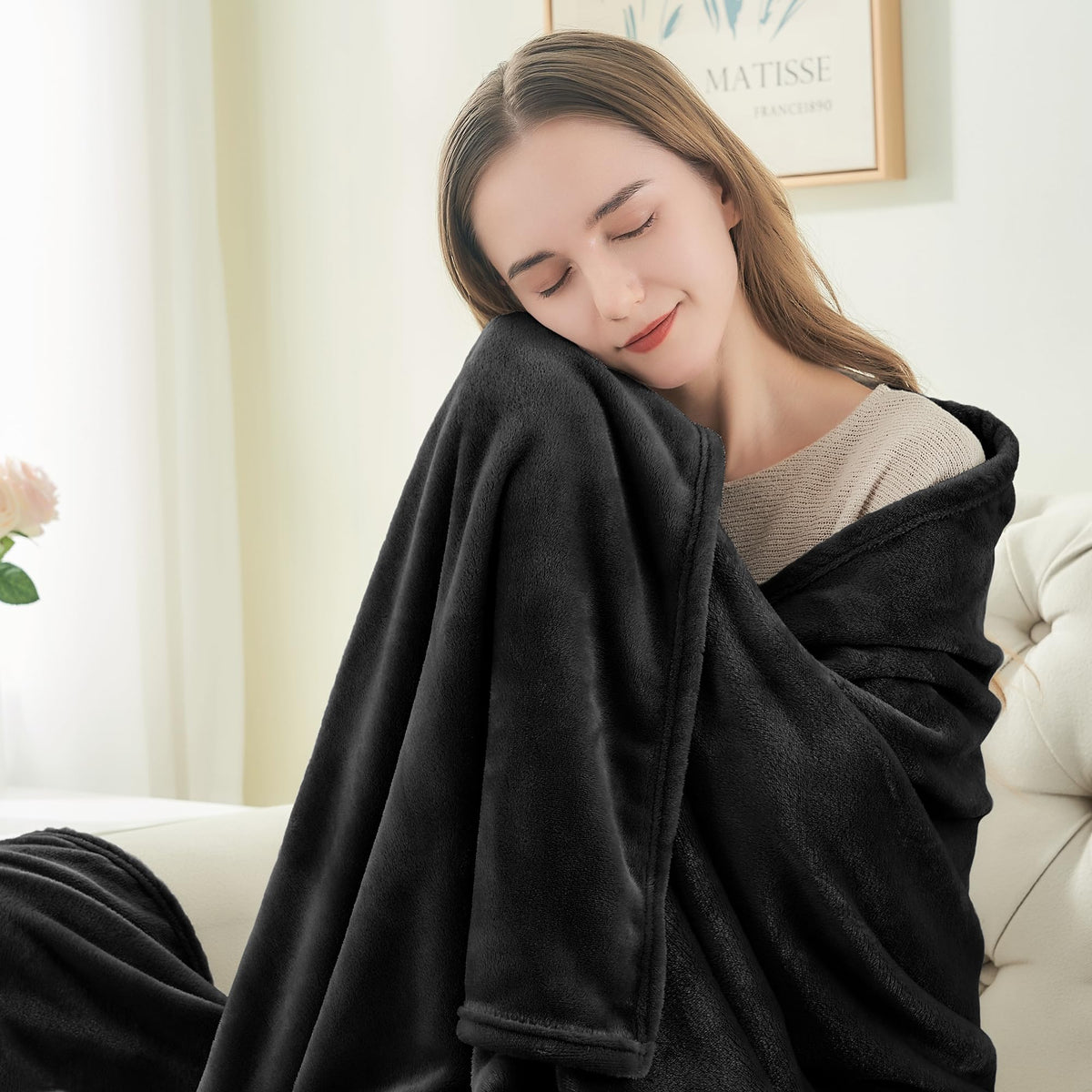 BEDELITE blanket folded on sofa highlights plush inviting surface.