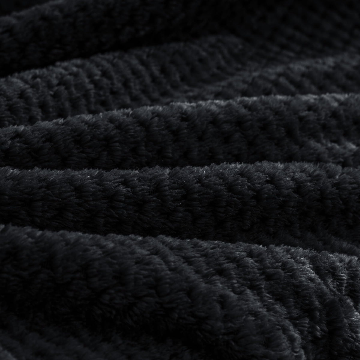 Compact fold showcases BEDELITE blanket as pillow substitute during travel.