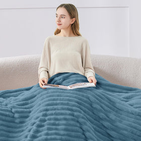 BEDELITE striped blanket on sofa enhances decor while keeping you warm.