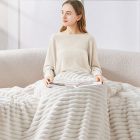 BEDELITE decorative striped blanket adds stylish texture to a bedroom.