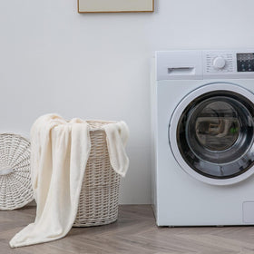 BEDELITE machine-washable queen white linens demonstrate easy care.