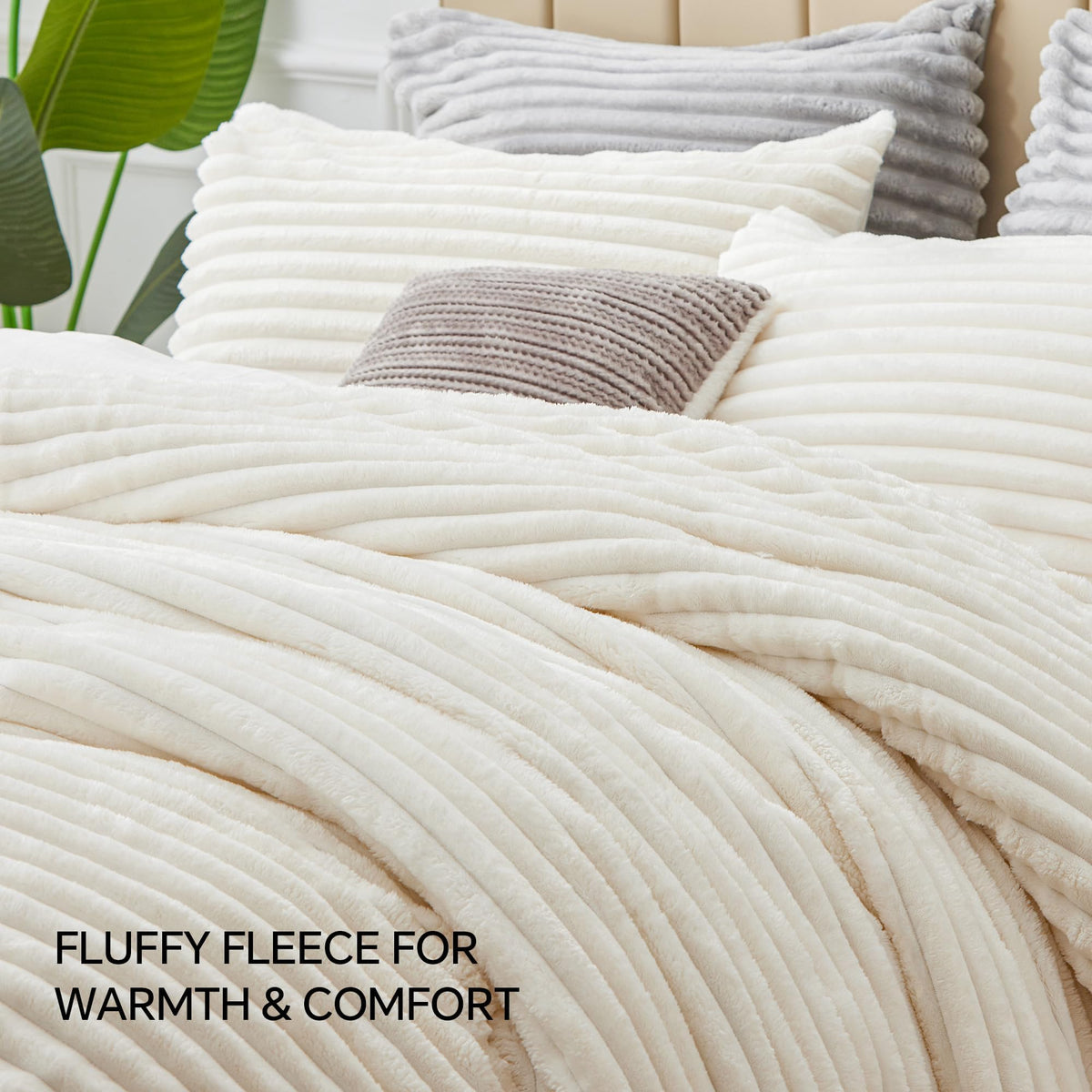 BEDELITE cream white bedding on bed creates a warm, inviting focal point.