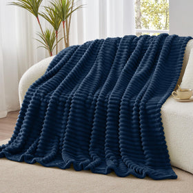 Cozy movie night with BEDELITE navy blanket draped over shoulder