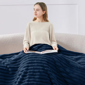 Navy BEDELITE throw folded neatly for display and storage