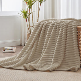 BEDELITE fleece throw ideal for camping or travel with lightweight warmth.