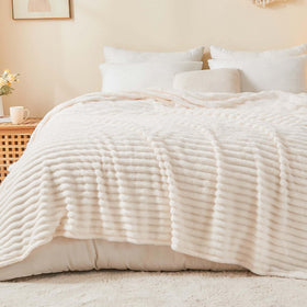 BEDELITE full-size striped blanket on bed delivers cozy warmth.