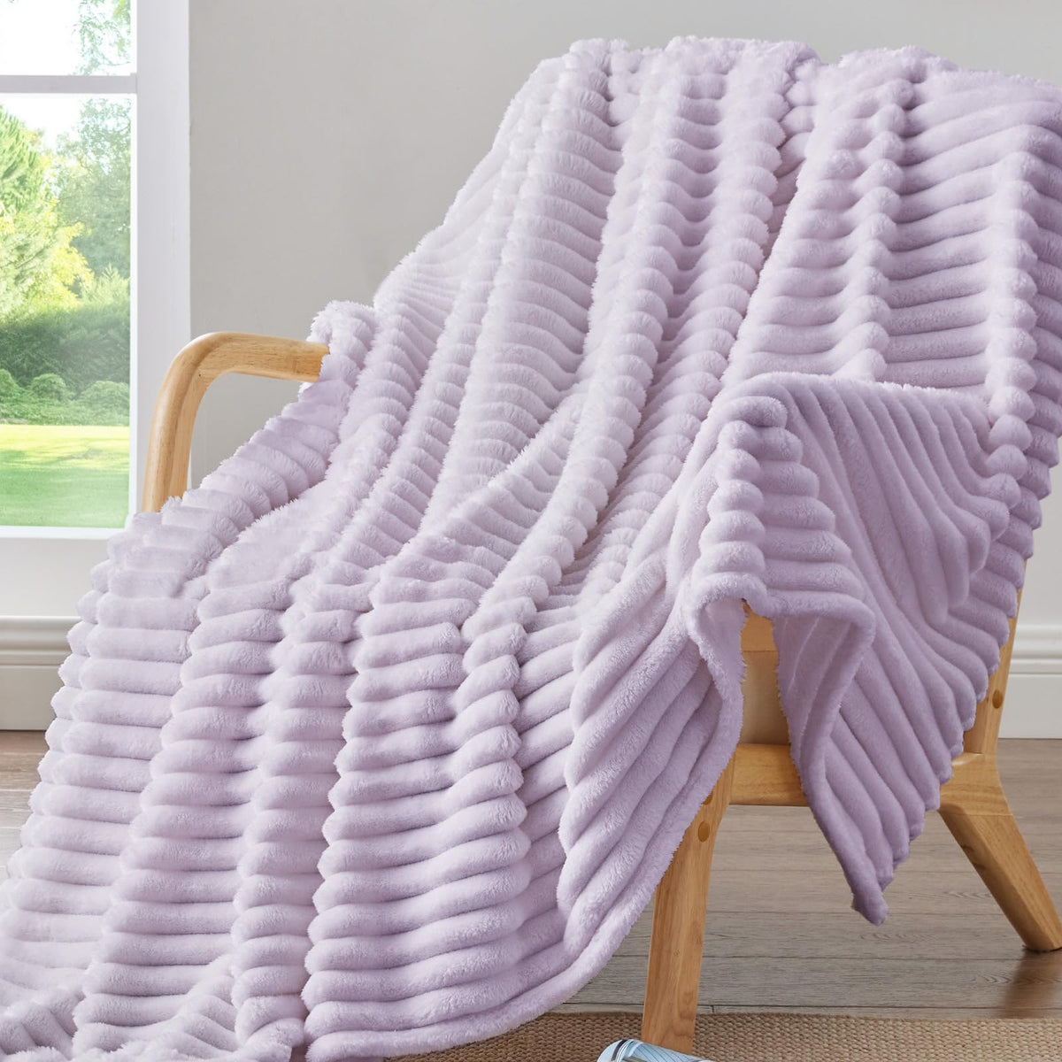 BEDELITE Lavender Fog fleece blanket on a sofa for cozy relaxation