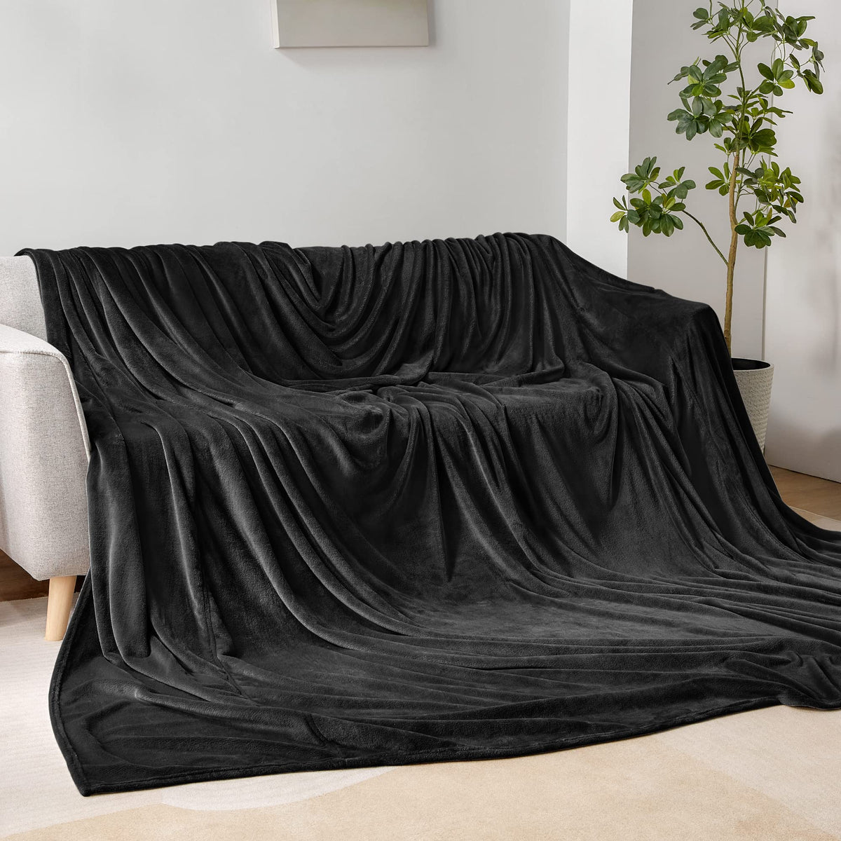 BEDELITE oversized king blanket on couch demonstrates extra-large warmth