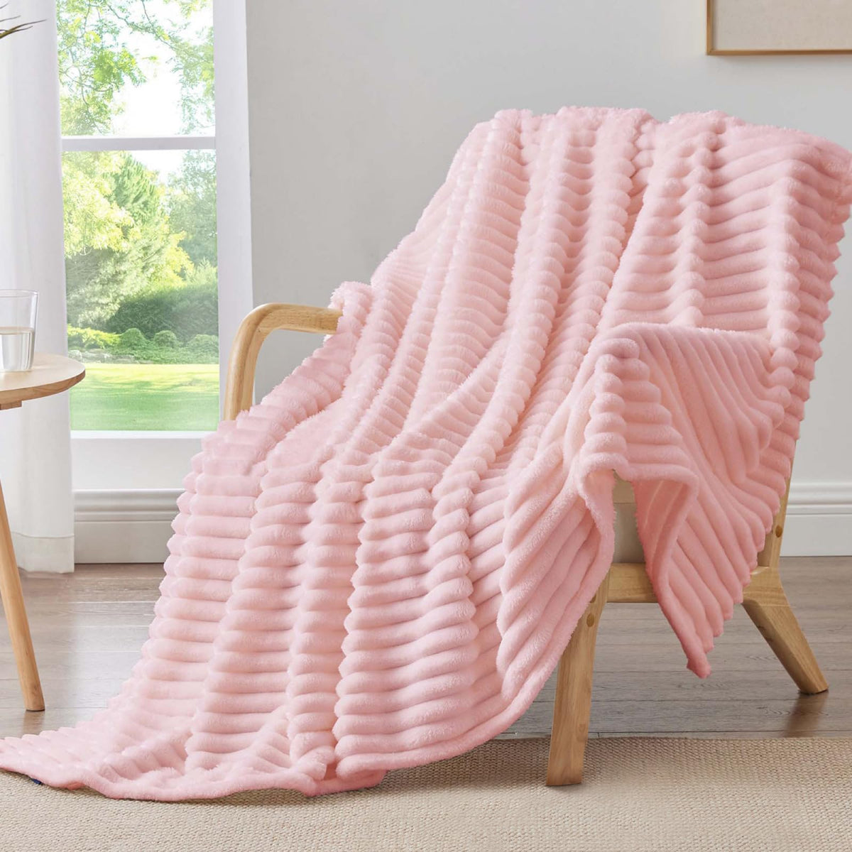 BEDELITE pink fleece throw blanket on couch for cozy movie nights