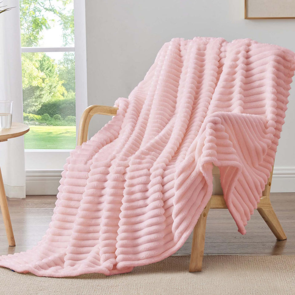 BEDELITE pink fleece throw blanket on couch for cozy movie nights