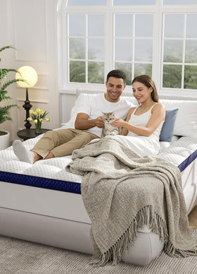 BEDELITE topper shown on a queen bed in a cozy bedroom setup.