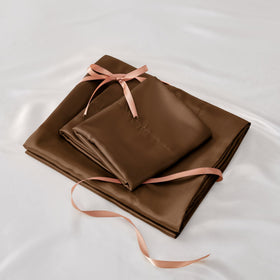 BEDELITE satin sheets enhance bedroom decor with elegant color and drape