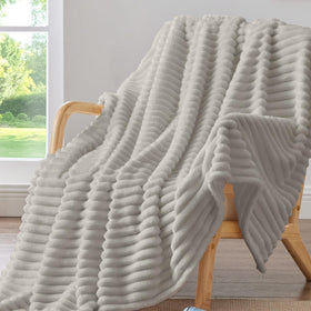 BEDELITE striped fleece blanket on couch for cozy warmth and style