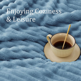 BEDELITE blue throw emphasizes stripe texture for versatile lounging and decoration.
