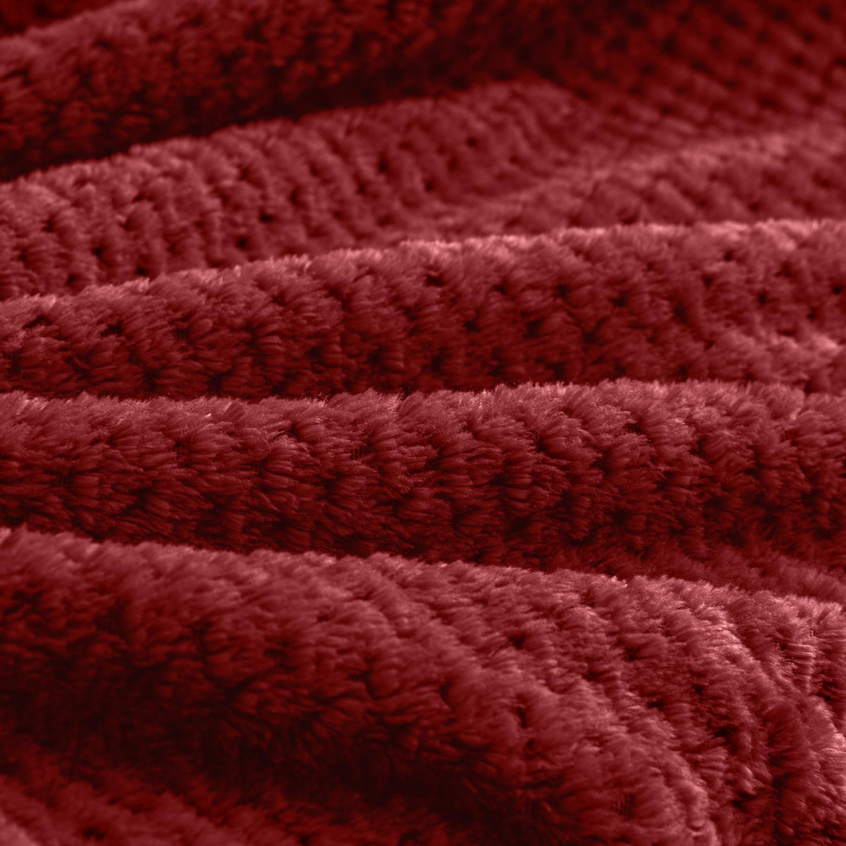 BEDELITE blanket folded into a compact pillow-ready shape.